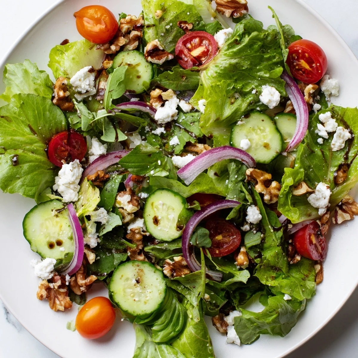 Tender greens and crisp vegetables in a fresh Spring Mix Salad with Vinaigrette, topped with crunchy walnuts and ready to serve.
