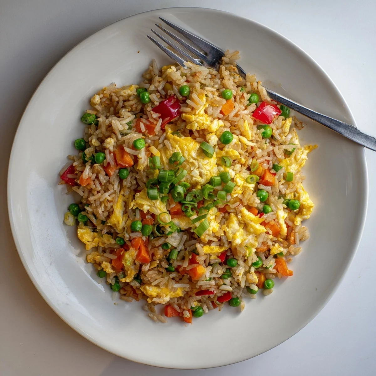 Colorful Fried Rice with bell peppers and egg, ready to serve as a main course or side.