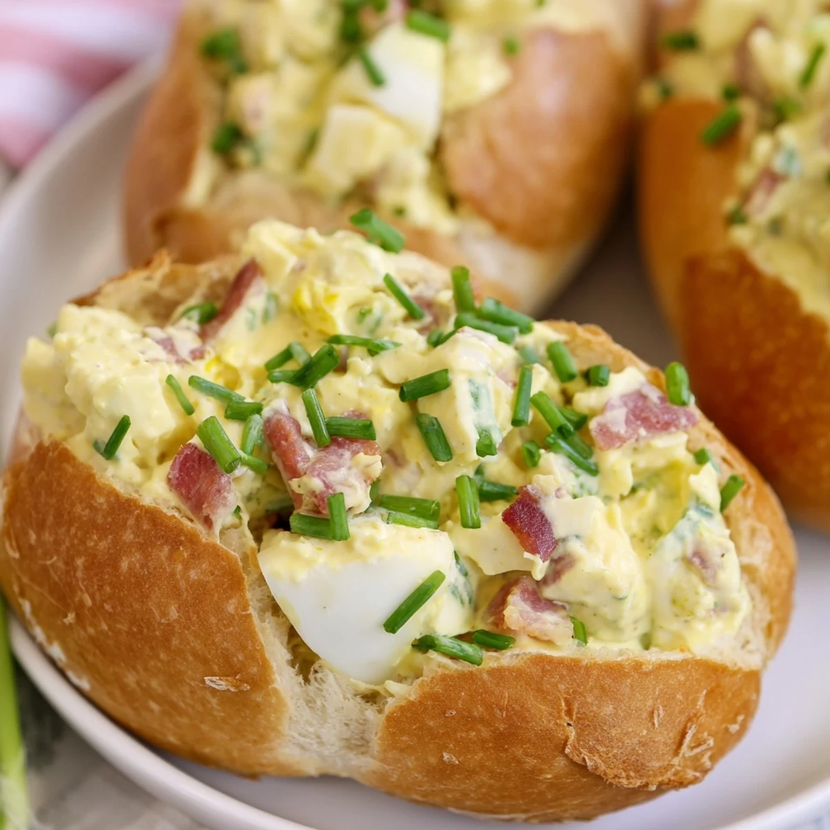 Close-up of the Easter Bunny Cob with Egg Salad, revealing creamy filling with celery and bacon bits.