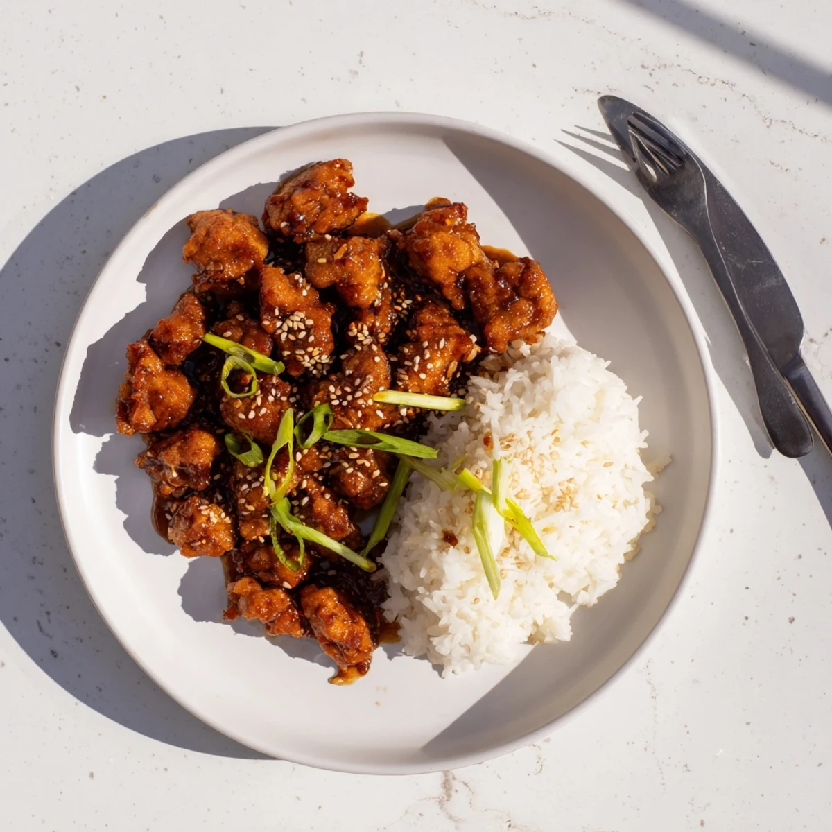 Crispy chicken thighs tossed in a sweet savory Mongolian sauce served over fluffy steamed white rice for dinner