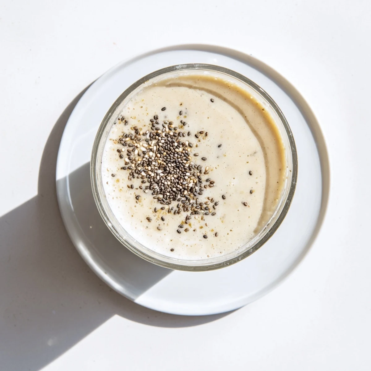 Thick protein-packed Greek yogurt banana smoothie blended with ice and a hint of vanilla
