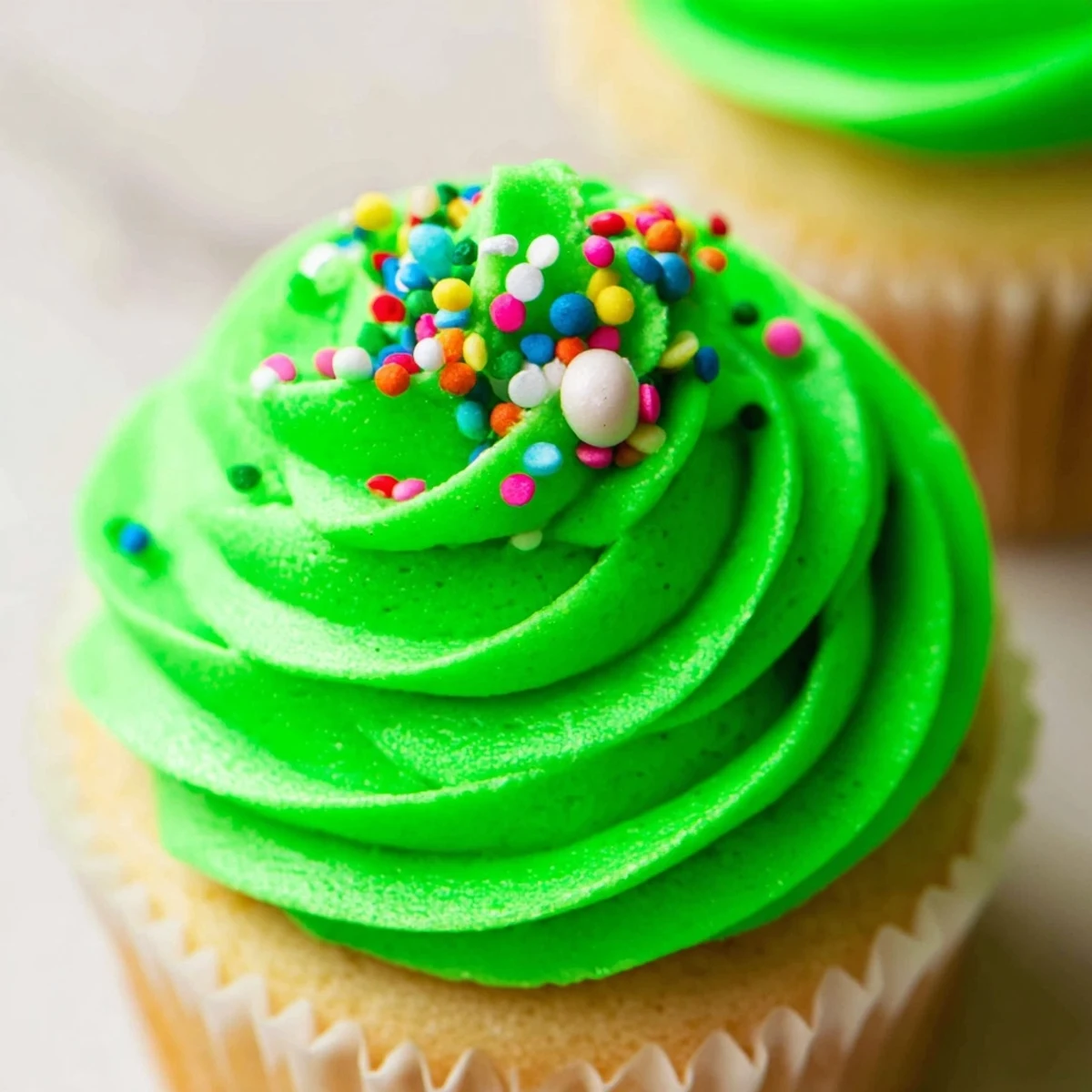 Holiday cupcake Christmas tree arrangement with gold star topper and green frosting