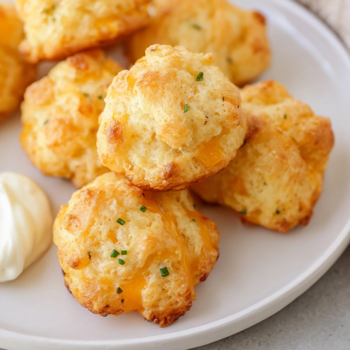 Golden Mashed Potato Cheese Puffs baked until crispy with melted cheddar throughout