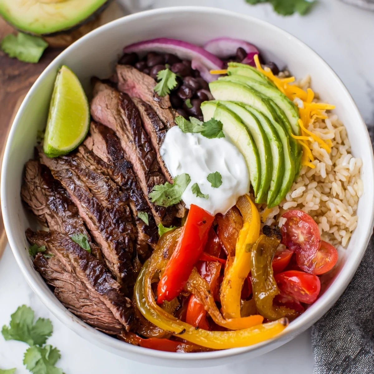 Steak Fajita Power Bowls with sizzling seared steak, charred peppers, creamy avocado.