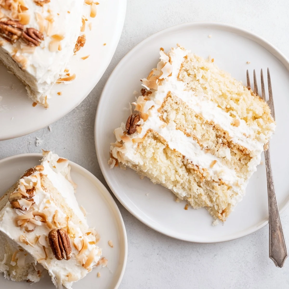 Rich Italian cream cake dessert sprinkled with pecans and sweet coconut flakes