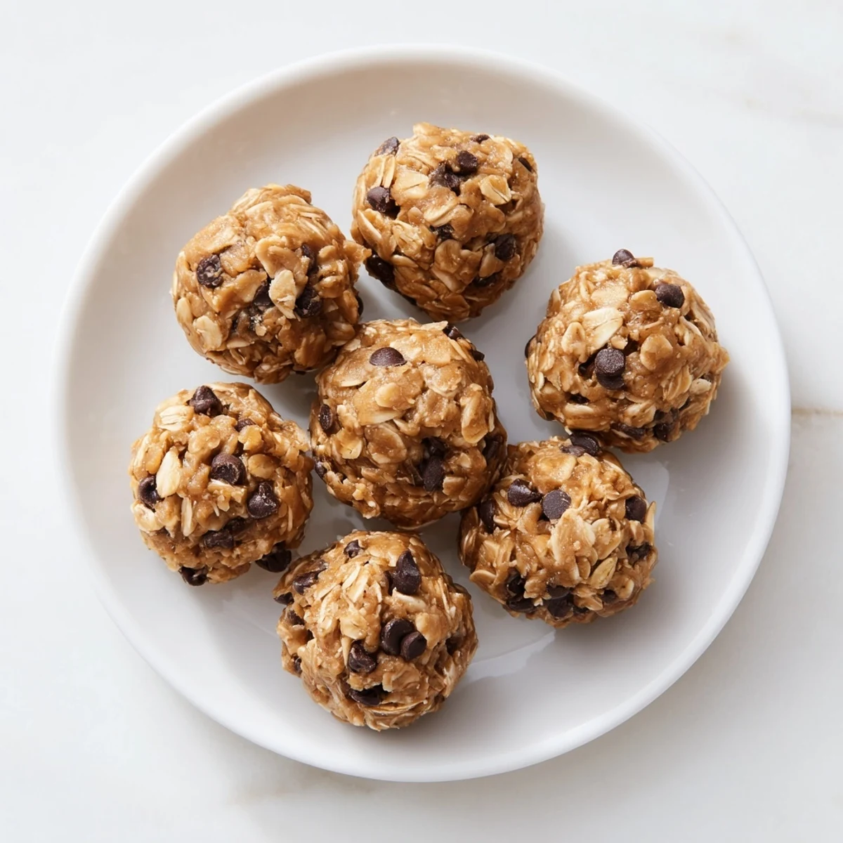 Homemade peanut butter energy balls with chocolate chunks ready for healthy snacking