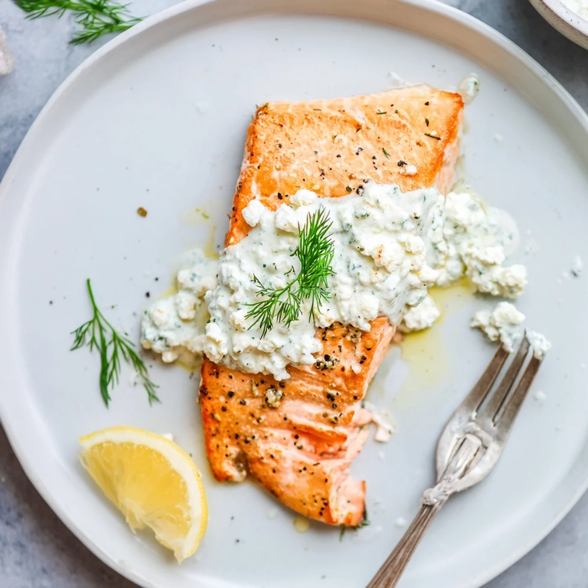Oven-roasted Salmon with Feta Dill Sauce, creamy tang atop flaky fillet