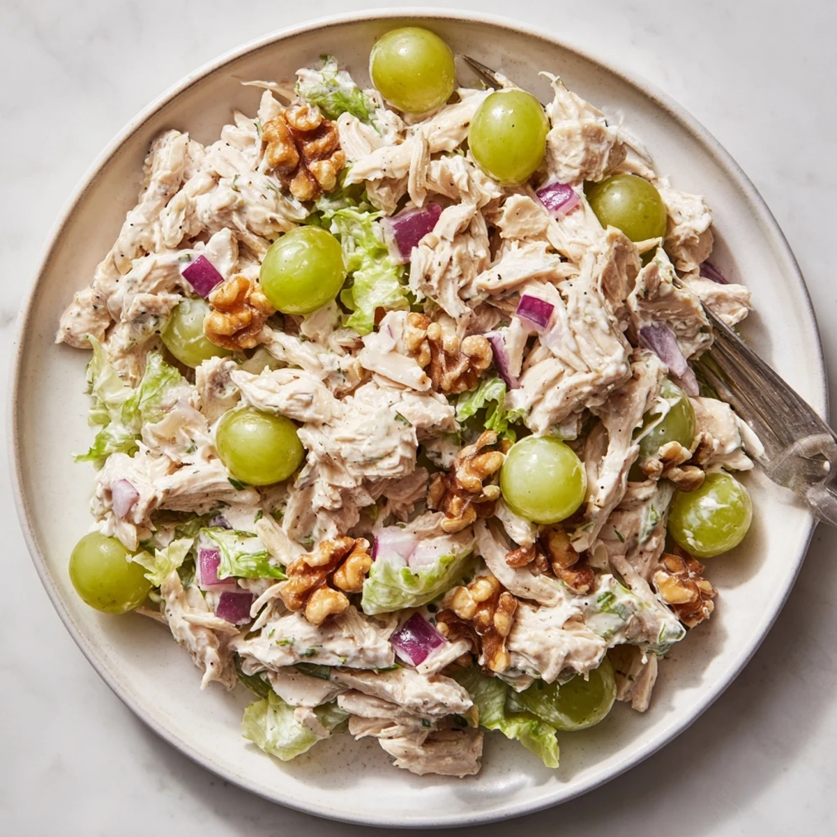 Easy Chicken Salad With Creamy Yogurt Dressing Recipe spooned into toasted pita