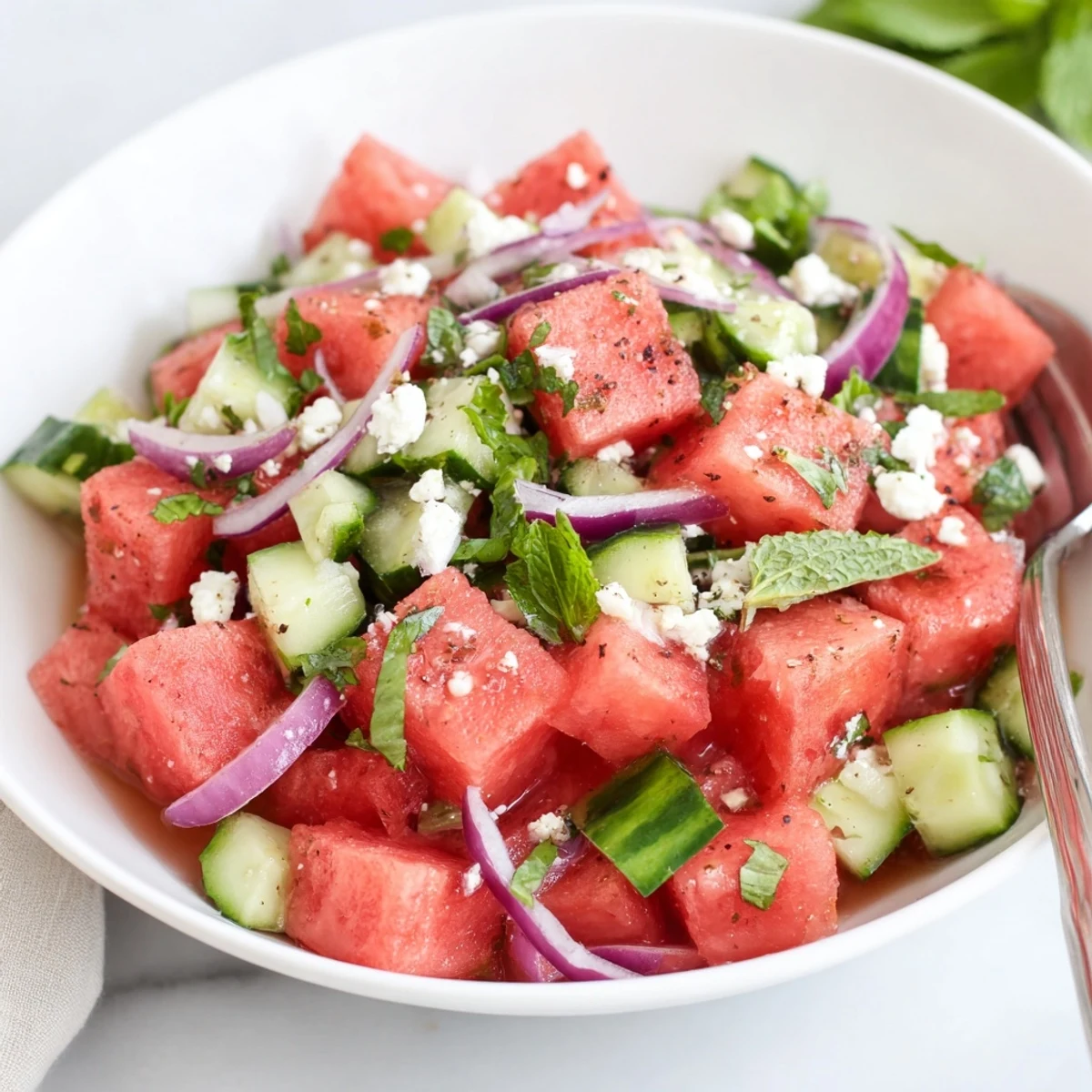 Watermelon Feta Salad Recipe drizzled with olive oil, honey, crisp cucumber bites