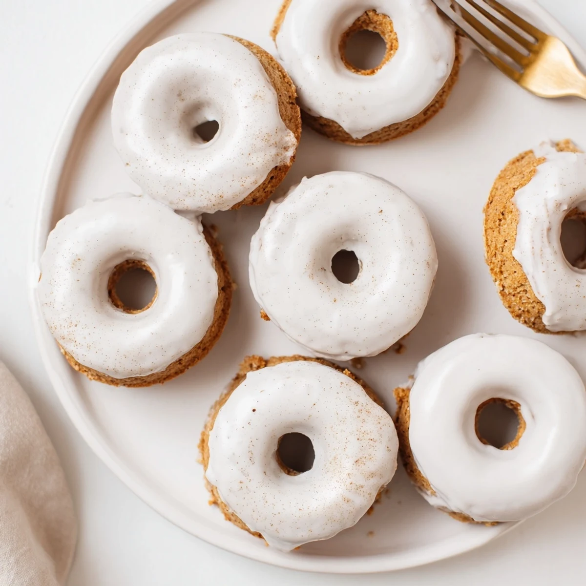 Freshly baked banana bread donuts with ripe banana chunks ready for breakfast dessert