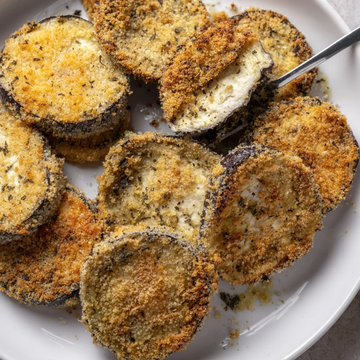 Crispy Baked Eggplant slices golden and crunchy, served with warm marinara dipping sauce