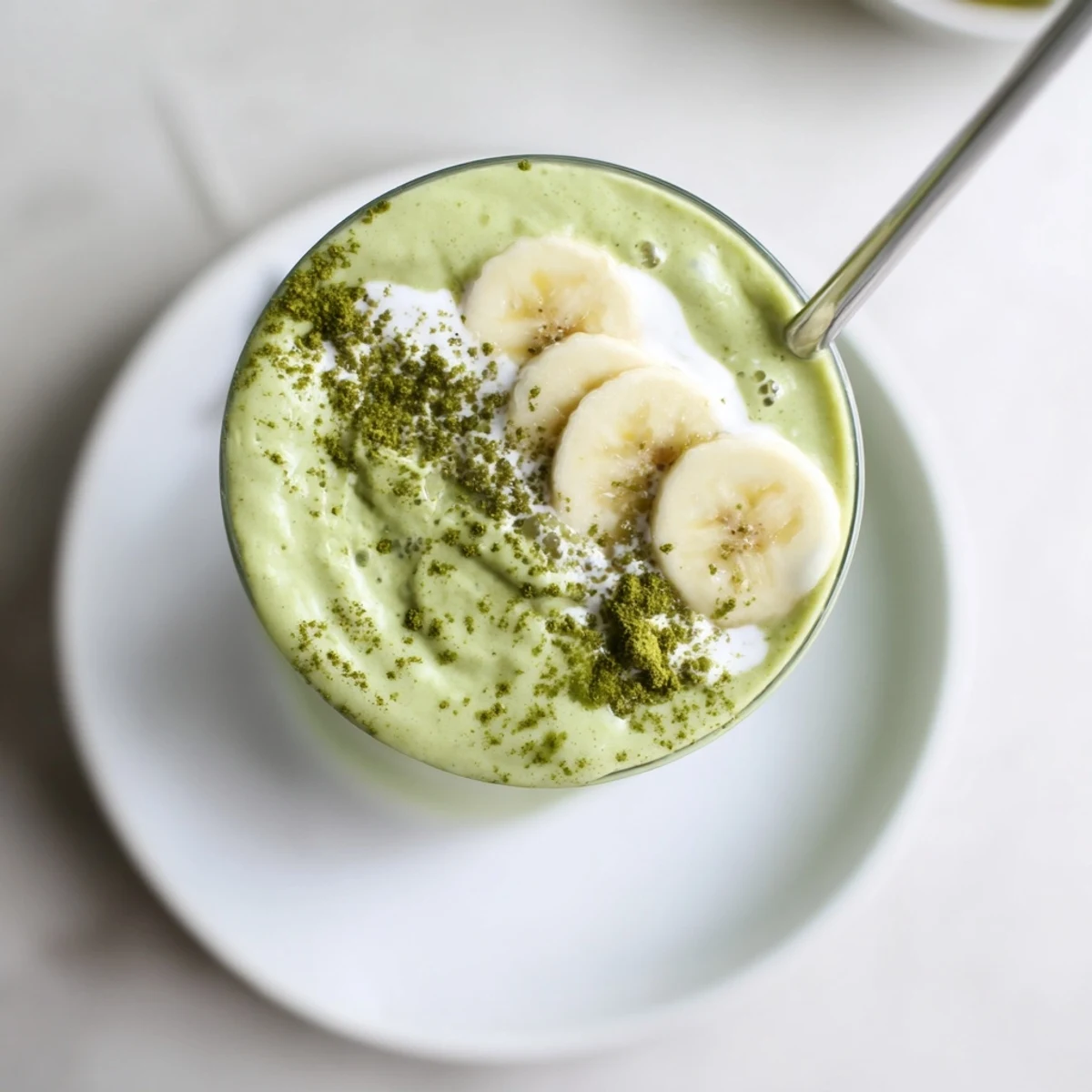 Refreshing Matcha Smoothie poured into glasses, icy texture and maple sweetness.