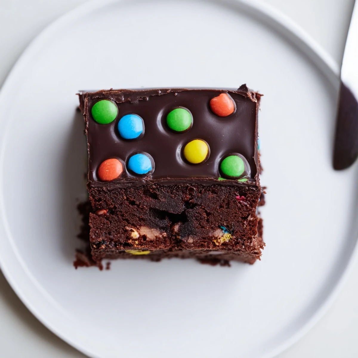 Gourmet Cosmic Brownies Bars topped with glossy ganache and colorful candy crunch