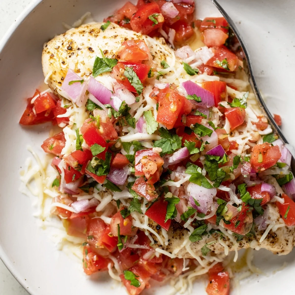 Salsa Fresca Chicken Bake with bubbling golden cheese and bright tomato salsa