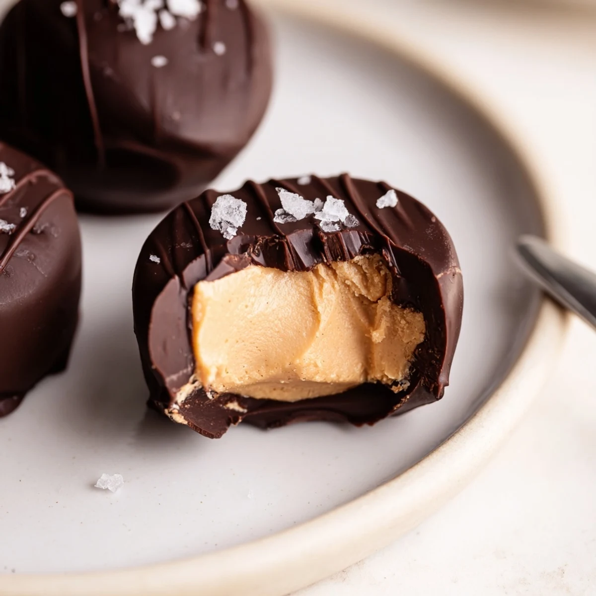 Frozen Peanut Butter Greek Yogurt Bites Dipped In Dark Chocolate With Sea Salt, glossy