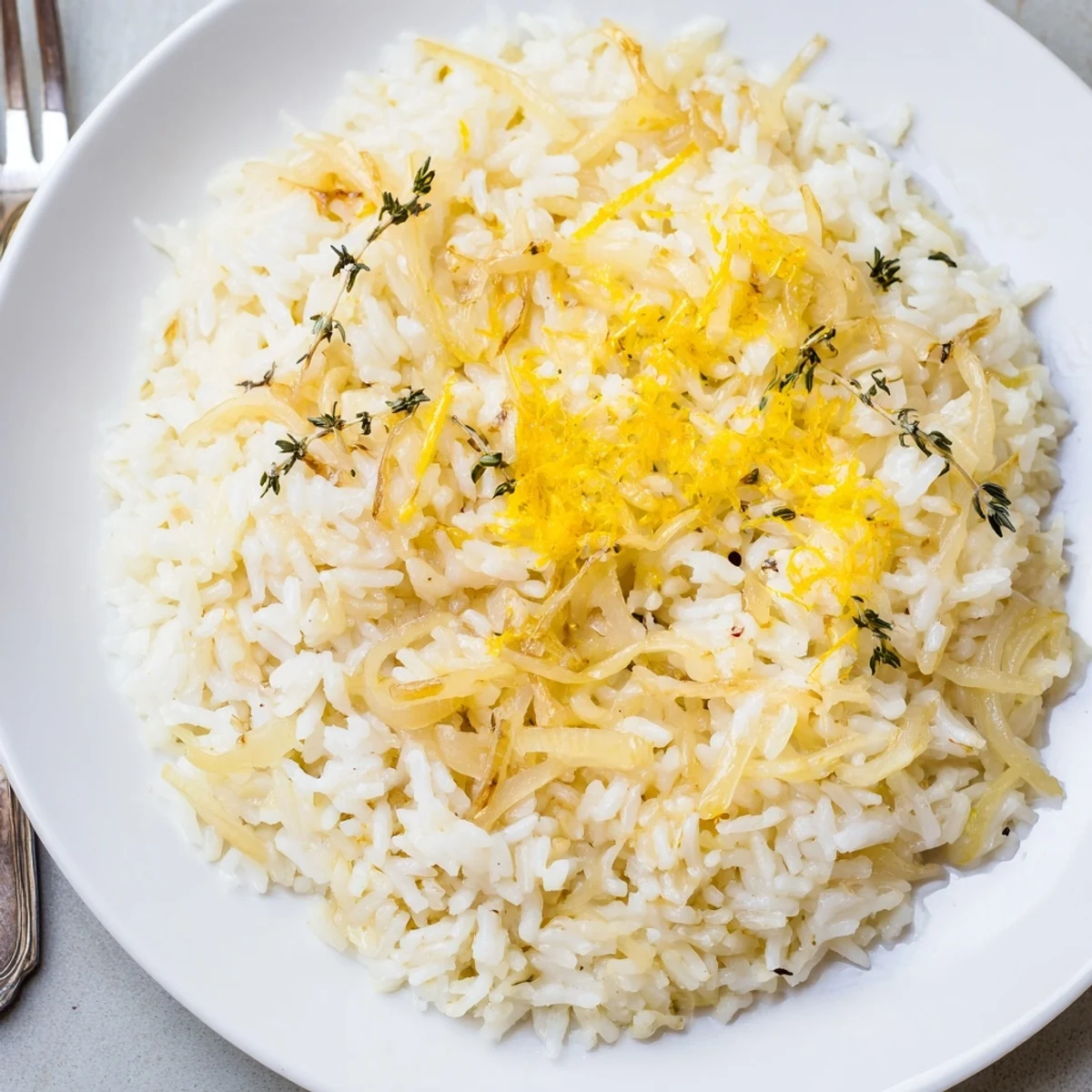 Comforting French Onion Soup Rice steaming on table, savory broth and thyme