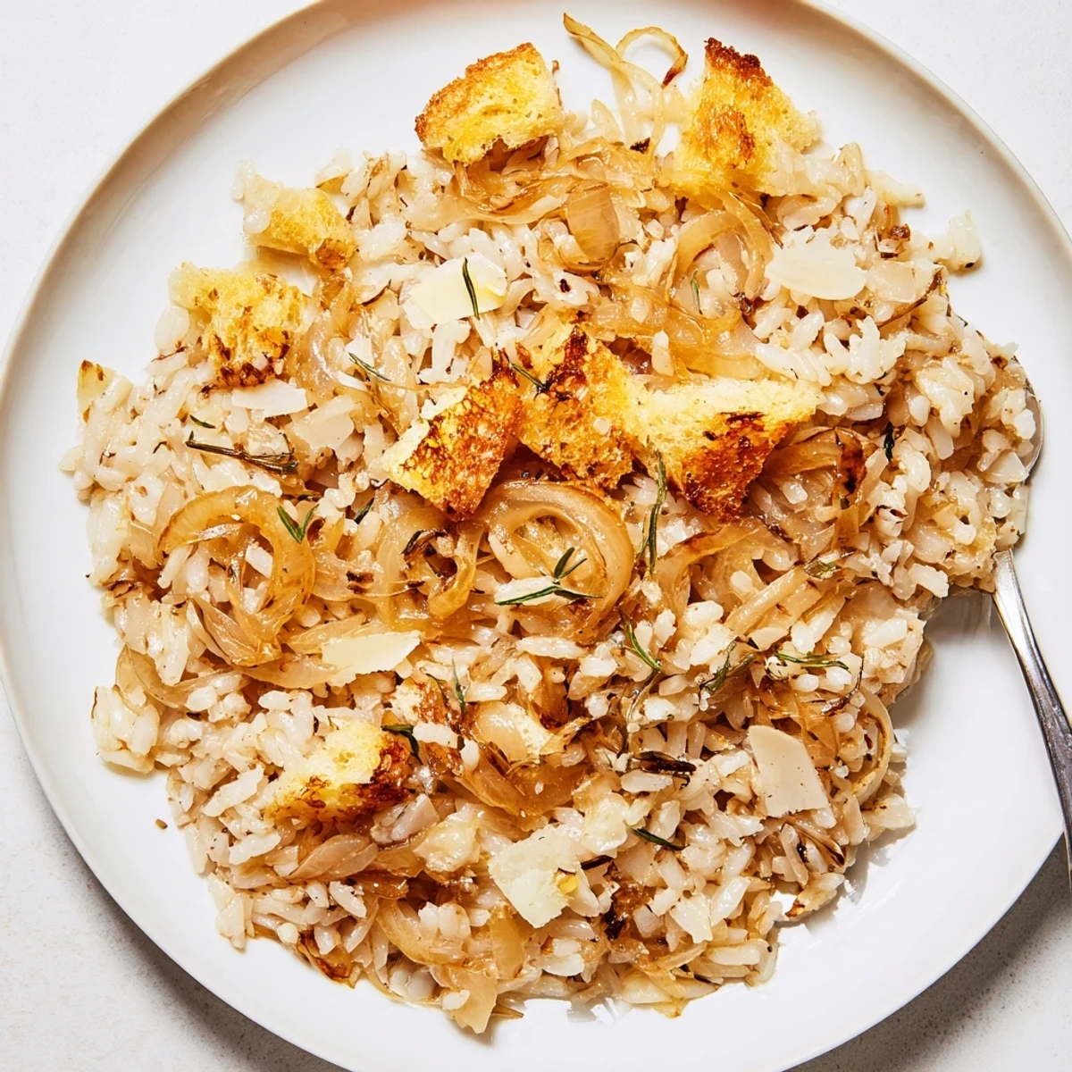 Oven-baked French Onion Soup Rice served warm with crunchy toasted crouton garnish