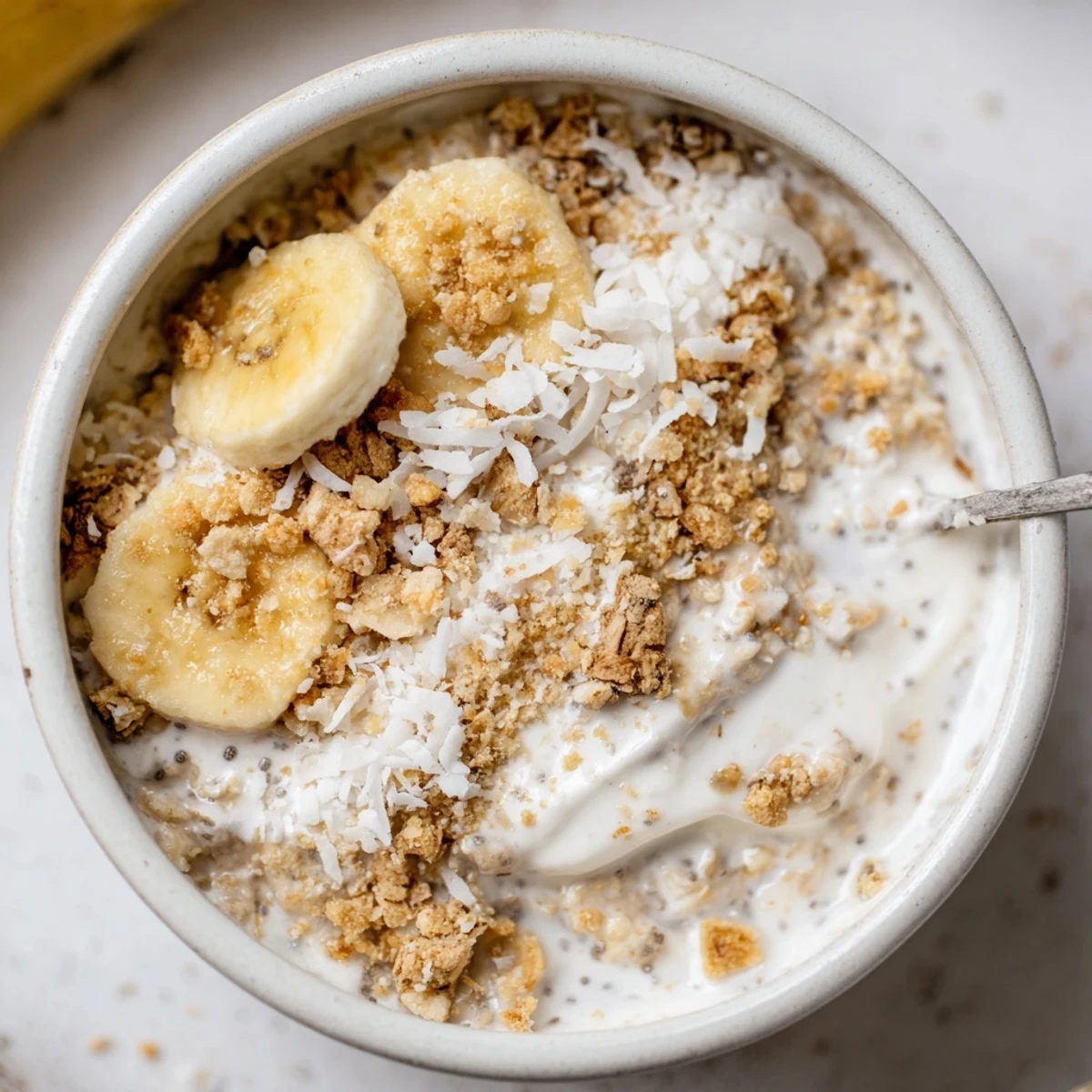 Velvety Coconut Cream Pie Overnight Oats with coconut milk aroma and crunchy flakes