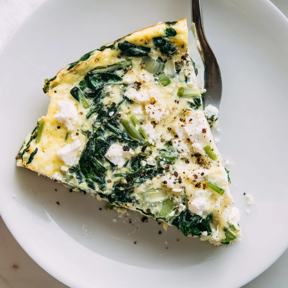 Spinach Frittata With Feta, golden top and fluffy interior served warm.