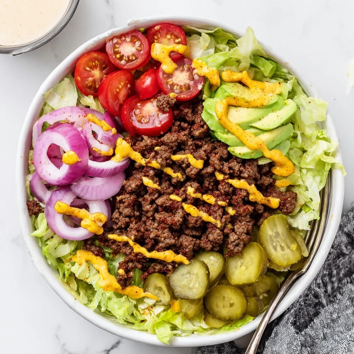 Savory Protein Packed Burger Bowls with sizzling seasoned beef and creamy avocado.