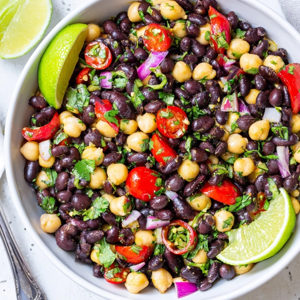 Marinated Cilantro Lime Bean Salad glistening with lime dressing and chopped cilantro