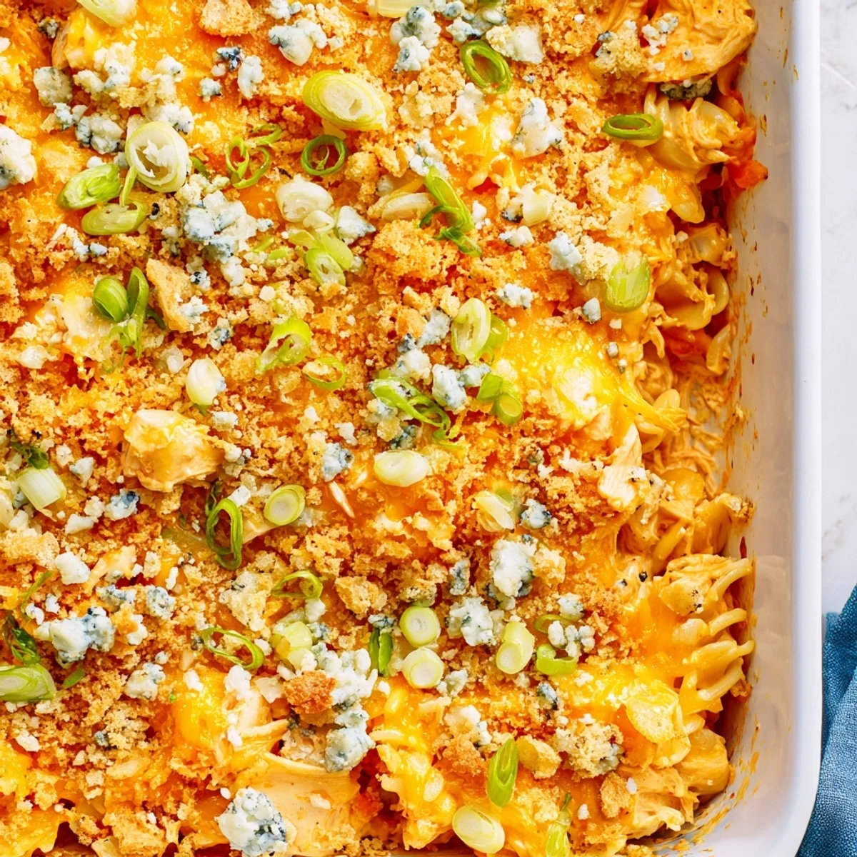 Golden bubbly Cheesy Buffalo Chicken Dip Casserole fresh from the oven with melted cheese
