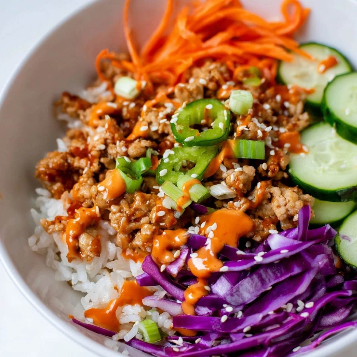 Seasoned ground turkey piled over fluffy jasmine rice with a generous swirl of Bang Bang Sauce