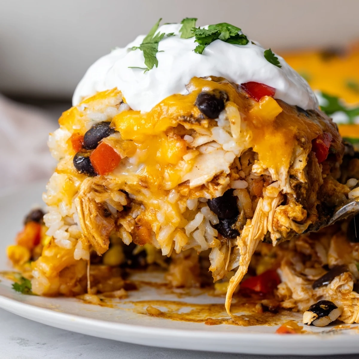 Golden bubbling chicken burrito casserole fresh from the oven with melted cheddar on top